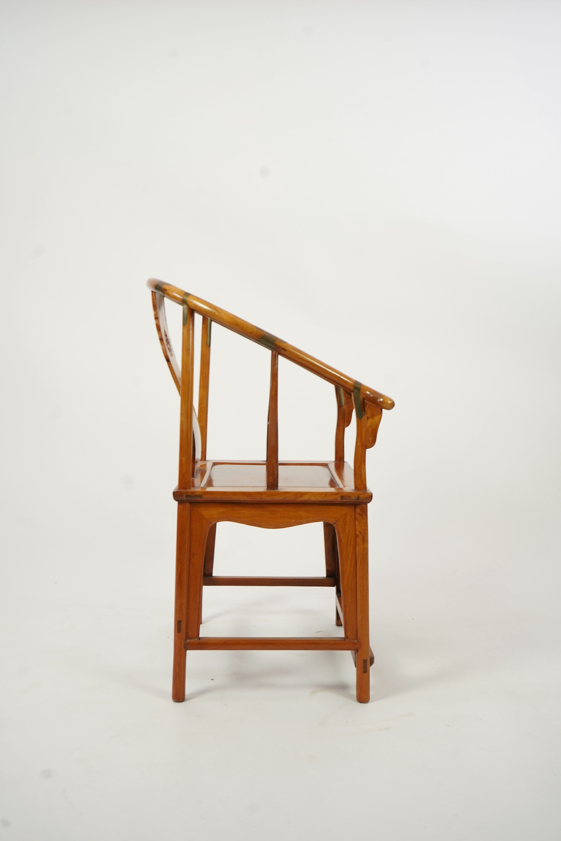 A Chinese huanghuali and brass mounted horseshoe-back armchair, quanyi, late 19th century
